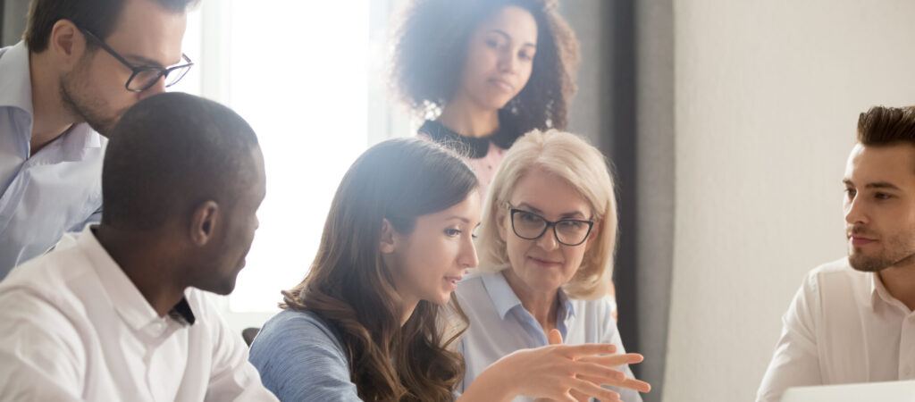 group of investors collaborating at conference table